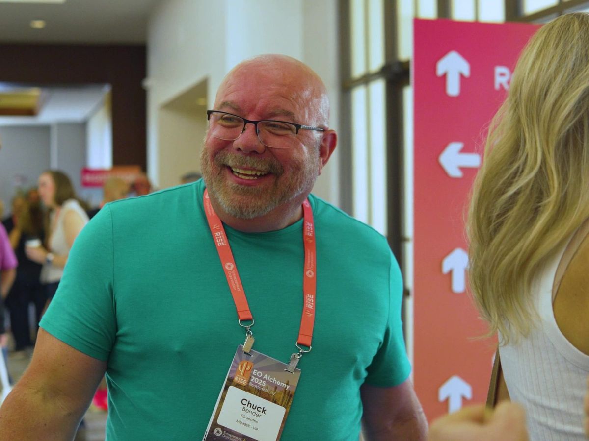 A member greeting friends at EO Alchemy registration